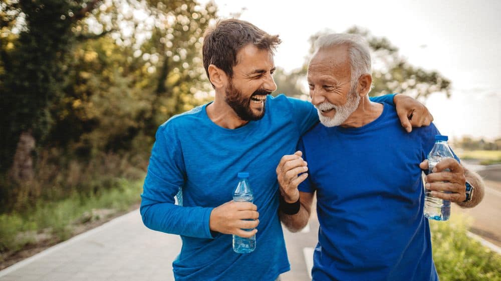father and adult son exercising together
