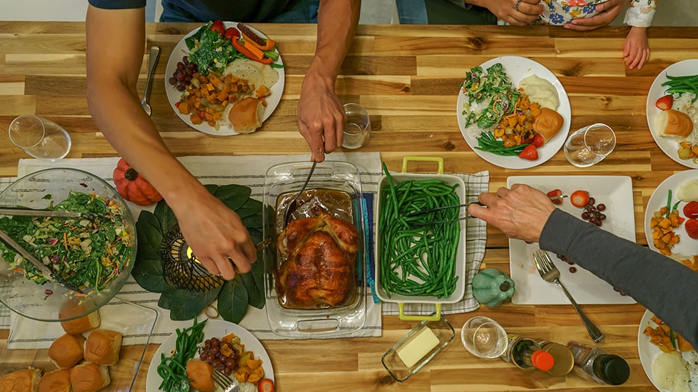 overhead view of family eating dinner