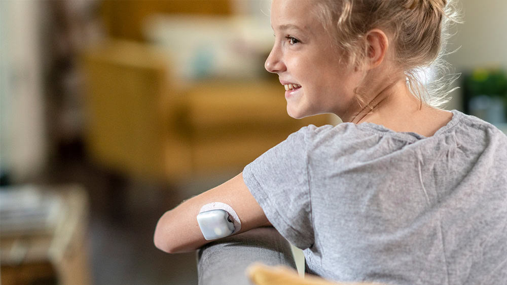Girl using wireless insulin pump
