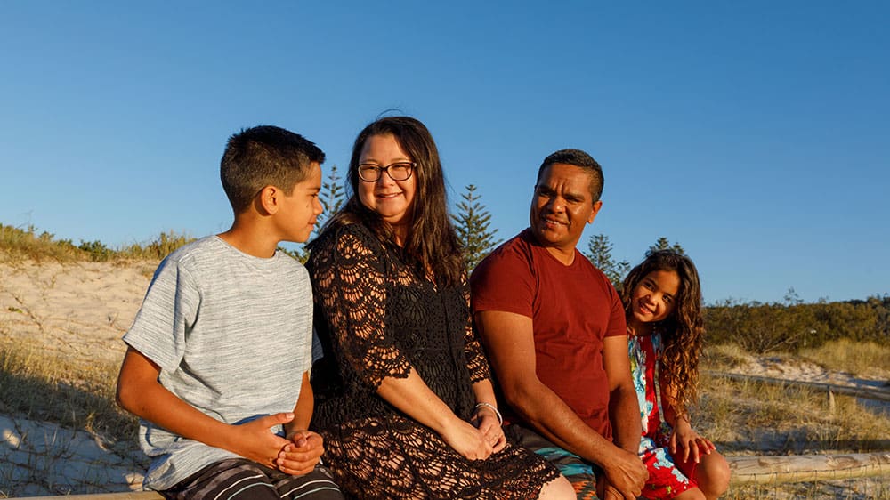 Family sitting outdoors together