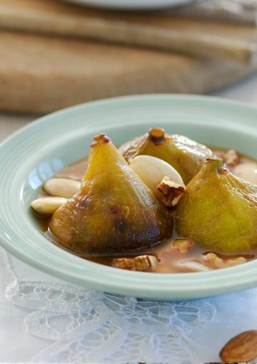 figs with nuts in a light blue serving bowl