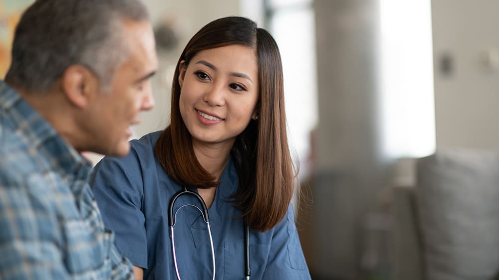 Health professional assisting a man