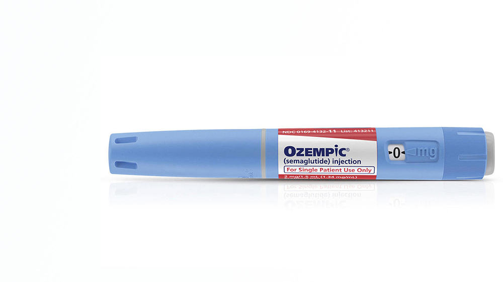 blue ozempic cartridge against a white background
