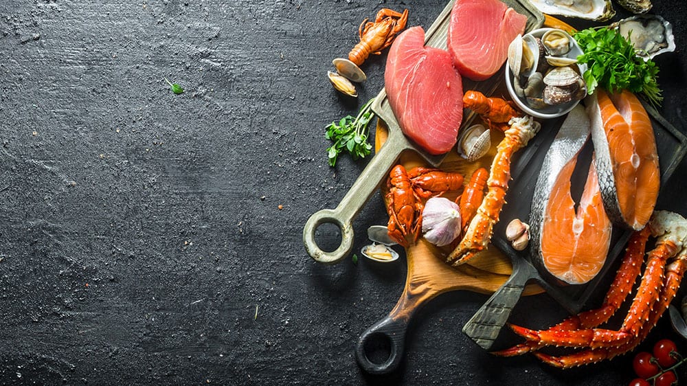 seafood, raw on a black background